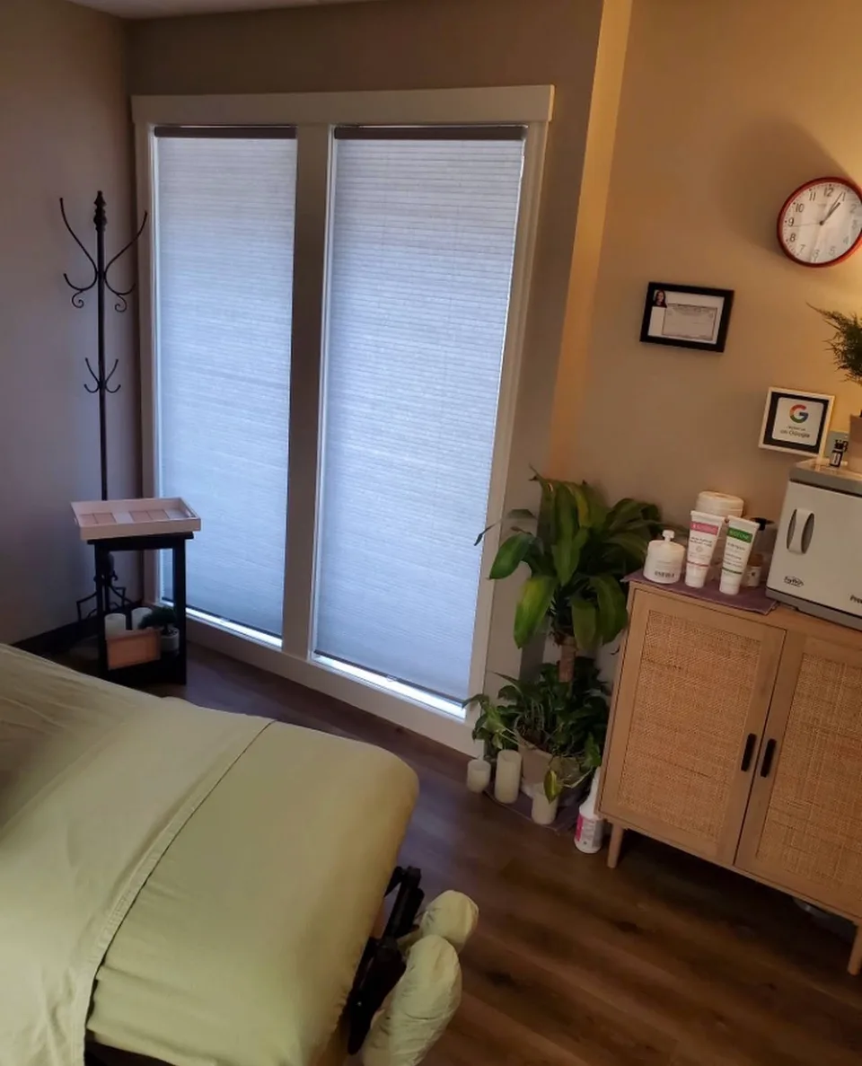 A neatly prepared massage table in a comfortable private room